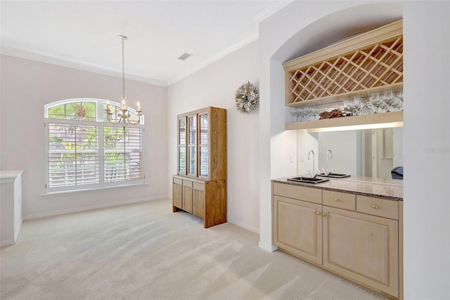 4730 Old Farm Rd, Sarasota, FL 34233 - interior space with light carpet, a chandelier, indoor wet bar, baseboards, and ornamental molding