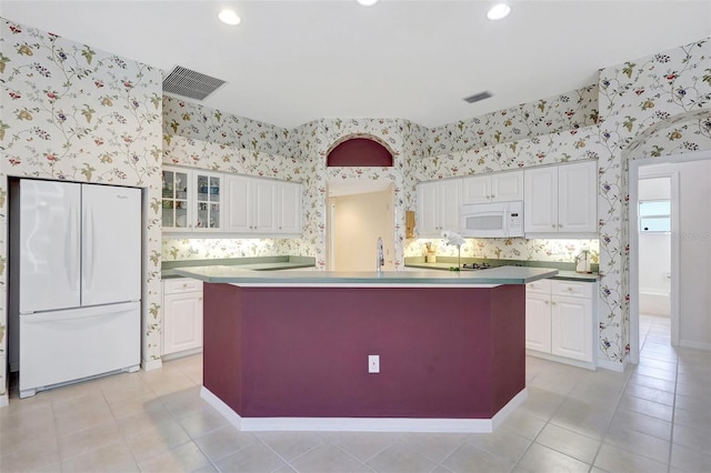 4730 Old Farm Rd, Sarasota, FL 34233 - kitchen featuring white appliances, wallpapered walls, and visible vents