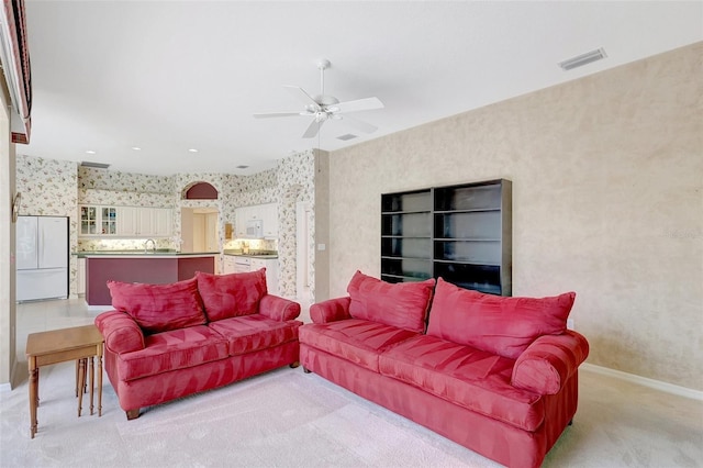 4730 Old Farm Rd, Sarasota, FL 34233 - living room with ceiling fan, visible vents, baseboards, light carpet, and wallpapered walls