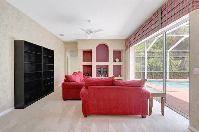 4730 Old Farm Rd, Sarasota, FL 34233 - carpeted living area featuring arched walkways, ceiling fan, visible vents, and baseboards