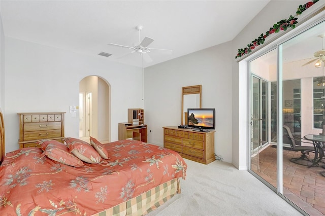 4730 Old Farm Rd, Sarasota, FL 34233 - bedroom with ceiling fan, light carpet, arched walkways, access to exterior, and visible vents