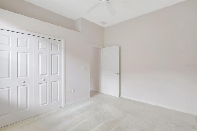 4730 Old Farm Rd, Sarasota, FL 34233 - unfurnished bedroom with a ceiling fan, baseboards, light carpet, and a closet