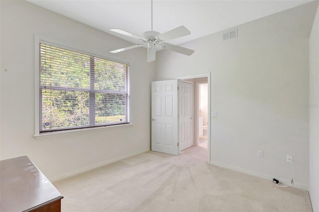 4730 Old Farm Rd, Sarasota, FL 34233 - unfurnished bedroom featuring visible vents, baseboards, multiple windows, and light colored carpet
