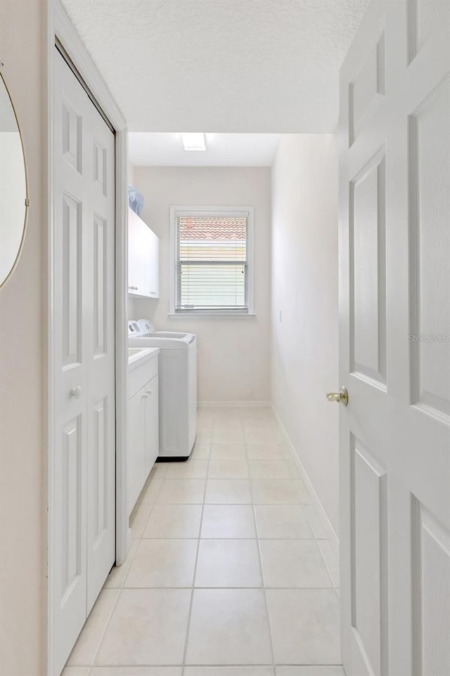 4730 Old Farm Rd, Sarasota, FL 34233 - clothes washing area with baseboards, cabinet space, independent washer and dryer, and light tile patterned flooring