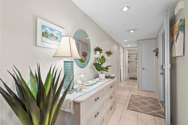 corridor with light tile patterned flooring and recessed lighting
