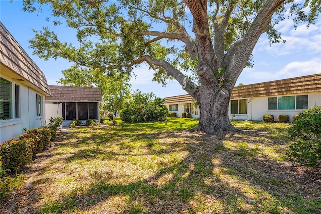 view of yard featuring a sunroom
