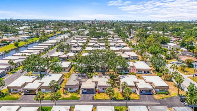 birds eye view of property with a residential view and a water view