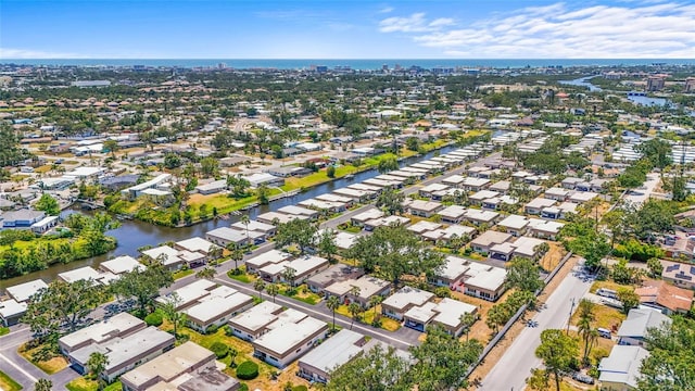 birds eye view of property featuring a residential view and a water view