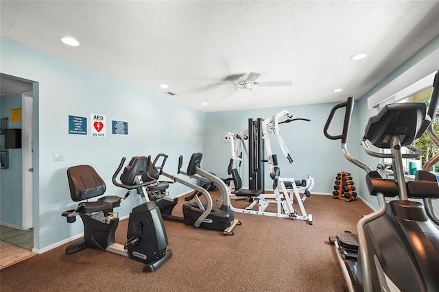 exercise room featuring recessed lighting, baseboards, and ceiling fan
