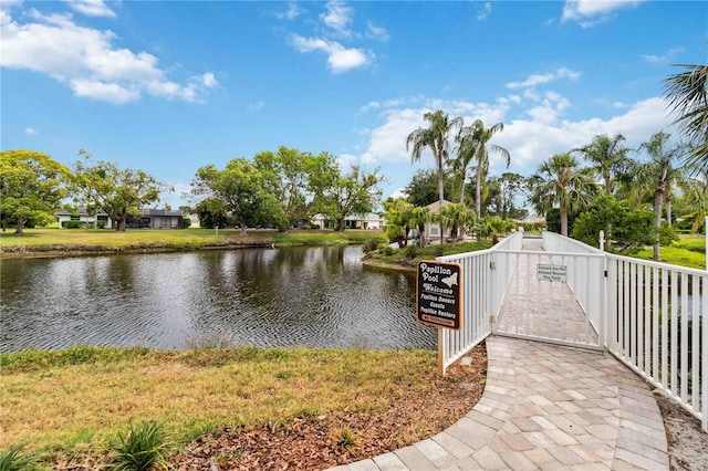 surrounding community featuring a water view