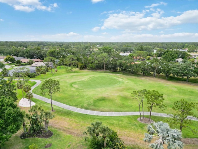 view of property's community featuring a yard and golf course view