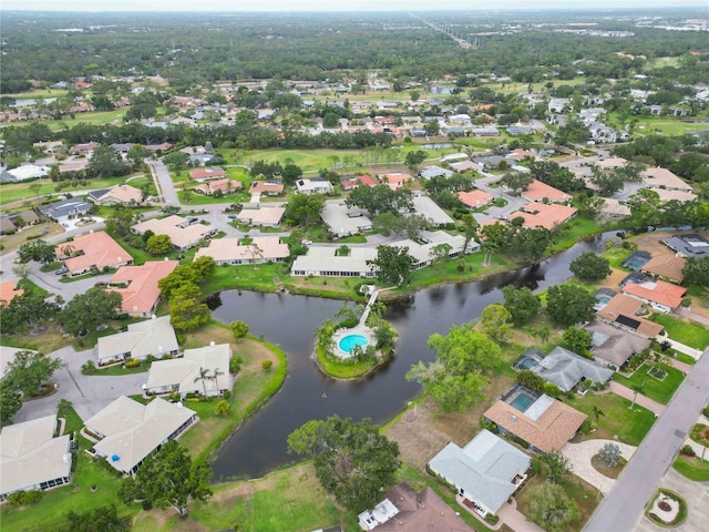 aerial view with a residential view and a water view