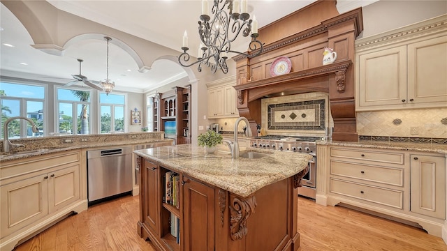 975 Whitakers Ln, Sarasota, FL 34236 - kitchen featuring cream cabinetry, stainless steel appliances, a sink, recessed lighting, and ornamental molding