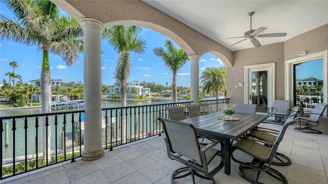 975 Whitakers Ln, Sarasota, FL 34236 - balcony featuring ceiling fan, a water view, and outdoor dining area
