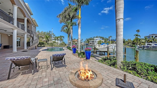 975 Whitakers Ln, Sarasota, FL 34236 - view of patio / terrace featuring stairway, a water view, an outdoor fire pit, a boat dock, and an outdoor pool