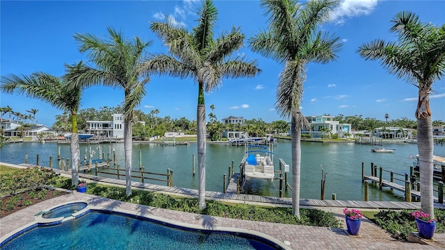 975 Whitakers Ln, Sarasota, FL 34236 - view of swimming pool featuring boat lift, a boat dock, and a water view