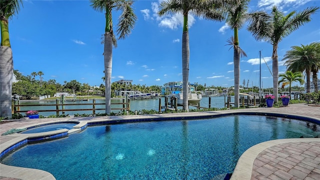 975 Whitakers Ln, Sarasota, FL 34236 - view of pool with a water view, a dock, a pool with connected hot tub, and boat lift