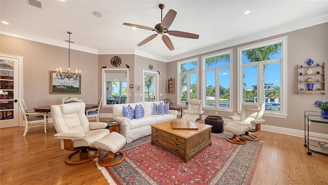 975 Whitakers Ln, Sarasota, FL 34236 - living area with light wood-style floors, ceiling fan, baseboards, crown molding, and a chandelier