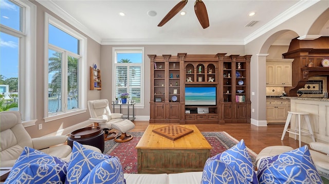975 Whitakers Ln, Sarasota, FL 34236 - living area featuring a ceiling fan, arched walkways, wood finished floors, baseboards, and recessed lighting