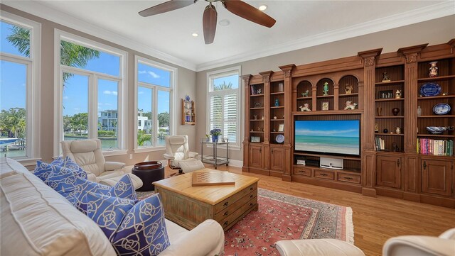 975 Whitakers Ln, Sarasota, FL 34236 - living area with ornamental molding, light wood-style flooring, ceiling fan, and recessed lighting