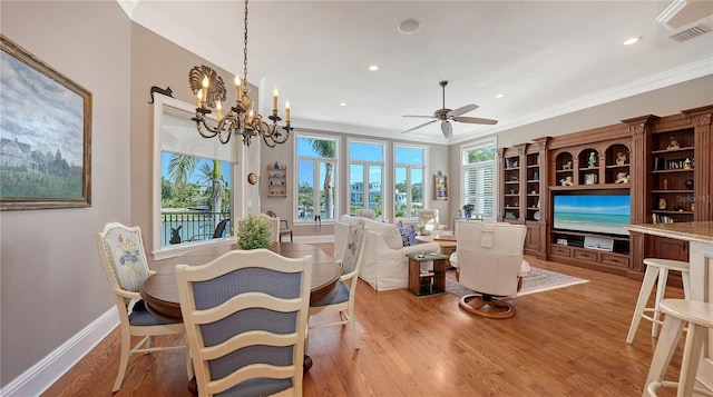 975 Whitakers Ln, Sarasota, FL 34236 - dining room featuring crown molding, light wood-style flooring, a ceiling fan, baseboards, and recessed lighting