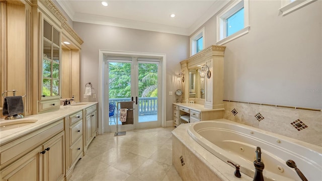 975 Whitakers Ln, Sarasota, FL 34236 - bathroom featuring a jetted tub, double vanity, tile patterned flooring, and ornamental molding