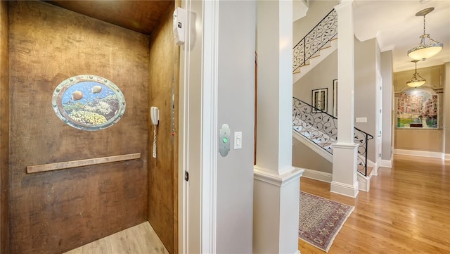 975 Whitakers Ln, Sarasota, FL 34236 - elevator featuring wood finished floors and baseboards