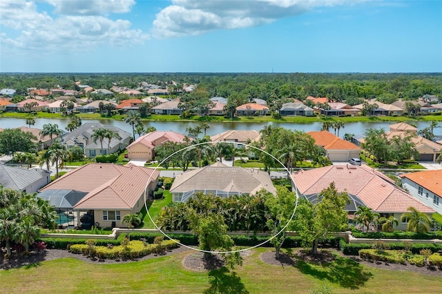 bird's eye view featuring a water view and a residential view
