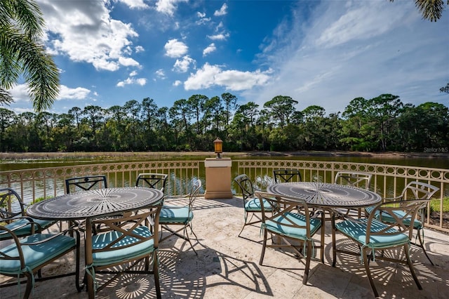 view of patio with a water view