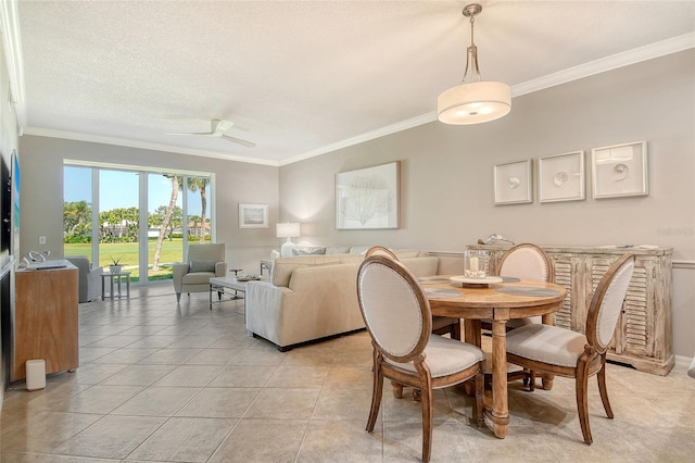 dining area featuring ornamental molding, a textured ceiling, a ceiling fan, and light tile patterned flooring