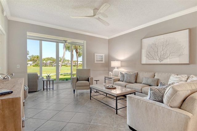 living area featuring a ceiling fan, a textured ceiling, light tile patterned flooring, and ornamental molding