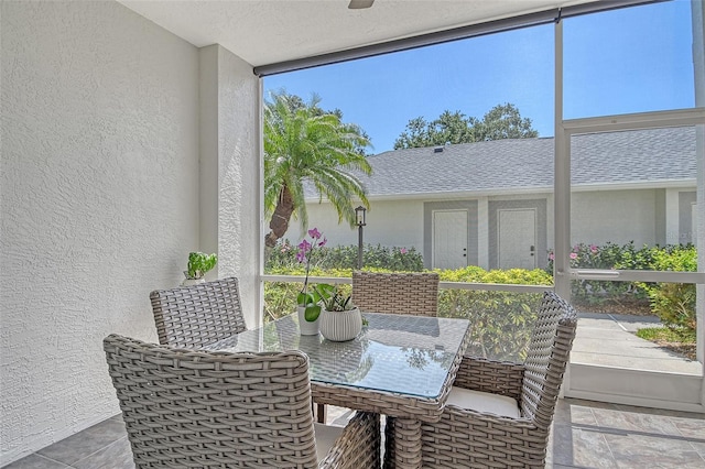 sunroom with outdoor dining space