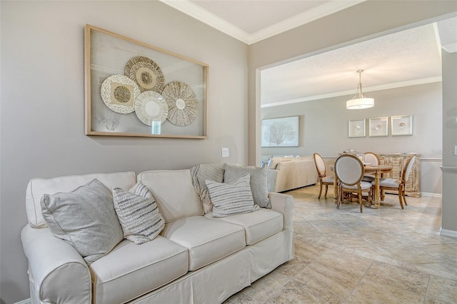 living room with baseboards, ornamental molding, and stone finish floor