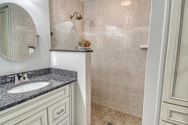 full bath featuring vanity and walk in shower