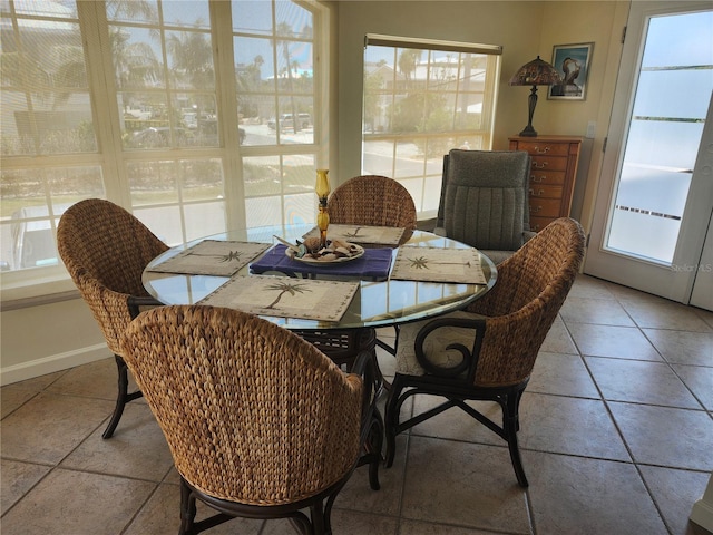 dining area with plenty of natural light and baseboards