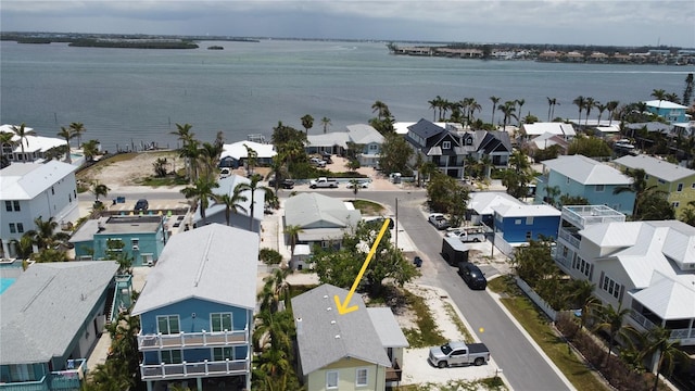 aerial view of residential area with a large body of water