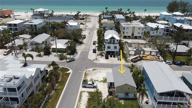 aerial view of residential area featuring expansive coastline