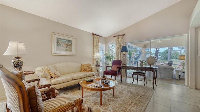 3984 Lyndhurst Ct, Sarasota, FL 34235 - living room featuring light tile patterned floors, plenty of natural light, and vaulted ceiling