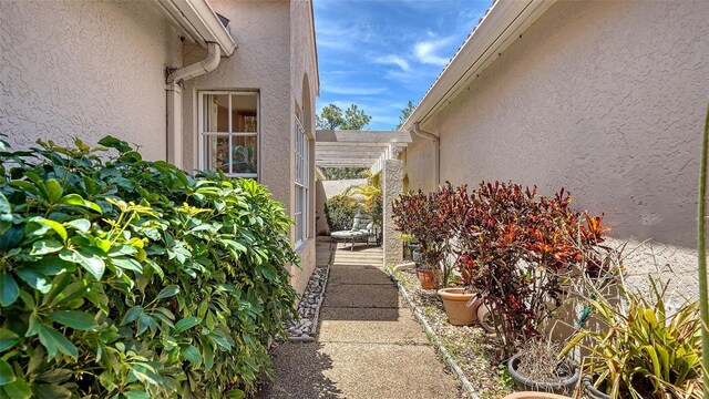 3984 Lyndhurst Ct, Sarasota, FL 34235 - view of property exterior featuring stucco siding