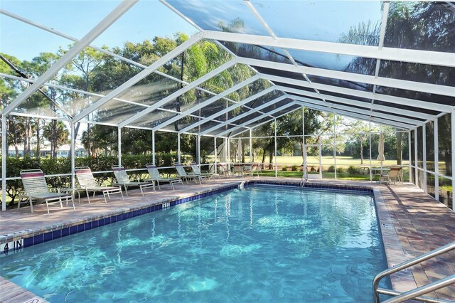 3984 Lyndhurst Ct, Sarasota, FL 34235 - pool featuring glass enclosure and a patio area