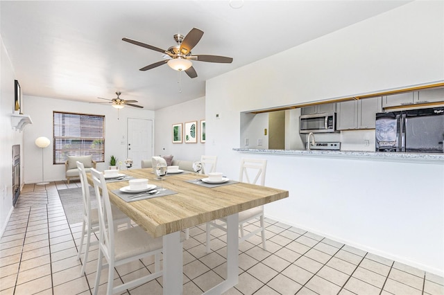 3781 59th Ave W Unit 3781, Bradenton, FL 34210 - dining room with light tile patterned floors, ceiling fan, and healthy amount of natural light
