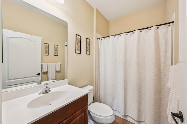 full bathroom featuring toilet, vanity, and a shower with shower curtain