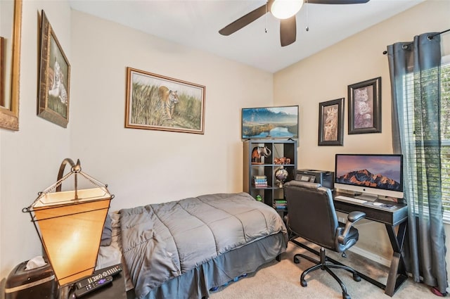 bedroom featuring carpet floors, a desk, and a ceiling fan
