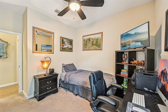 carpeted bedroom featuring a desk, baseboards, and a ceiling fan