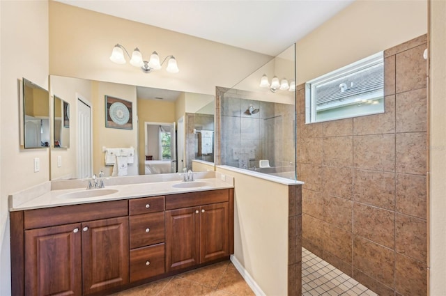 full bathroom featuring a walk in shower, tile patterned flooring, and double vanity