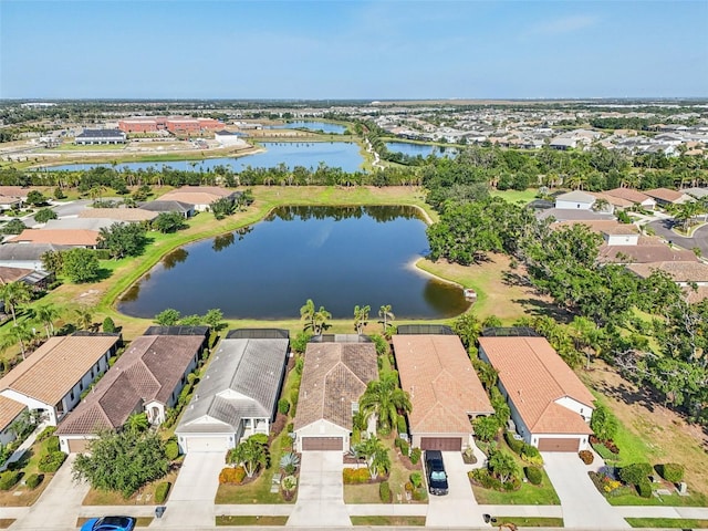 aerial view of residential area with a large body of water