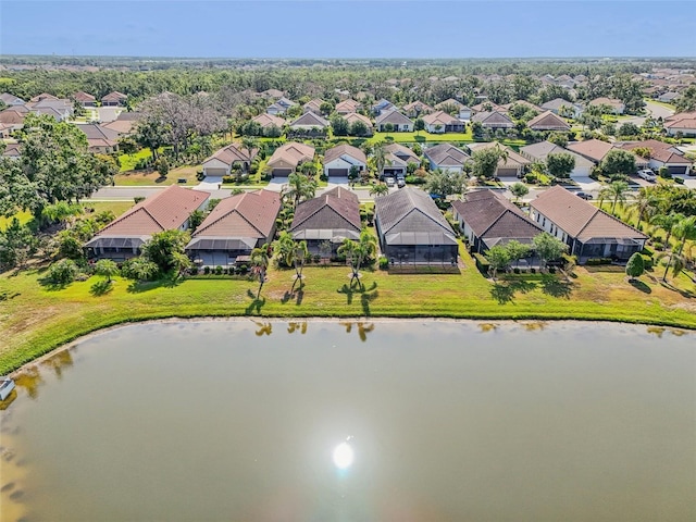 aerial view of residential area with a large body of water