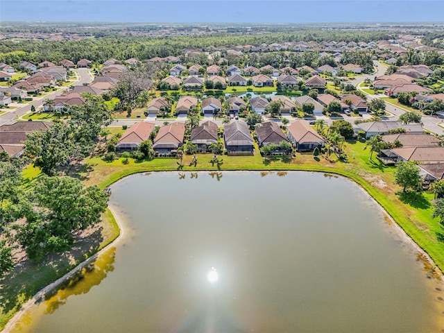 aerial perspective of suburban area with a nearby body of water