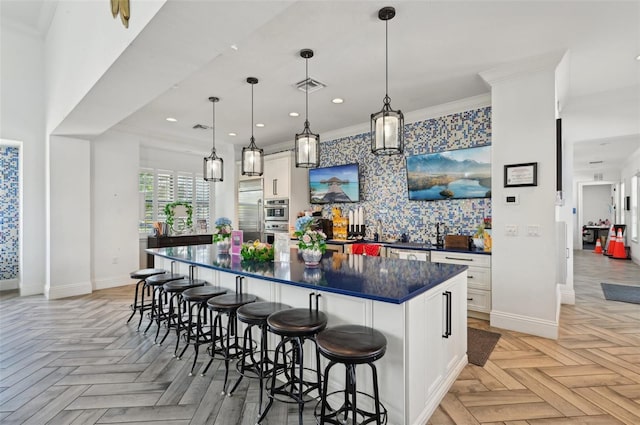 bar featuring baseboards, recessed lighting, ornamental molding, wallpapered walls, and pendant lighting
