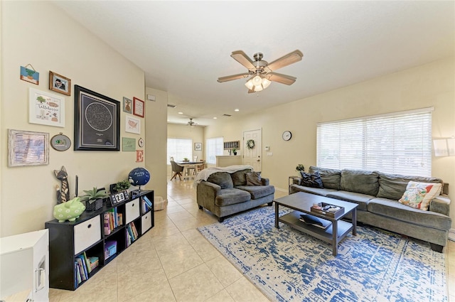 living area featuring a ceiling fan, recessed lighting, and light tile patterned flooring